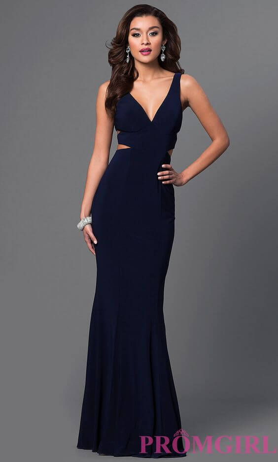 Girl in navy blue prom dress with strap detail.