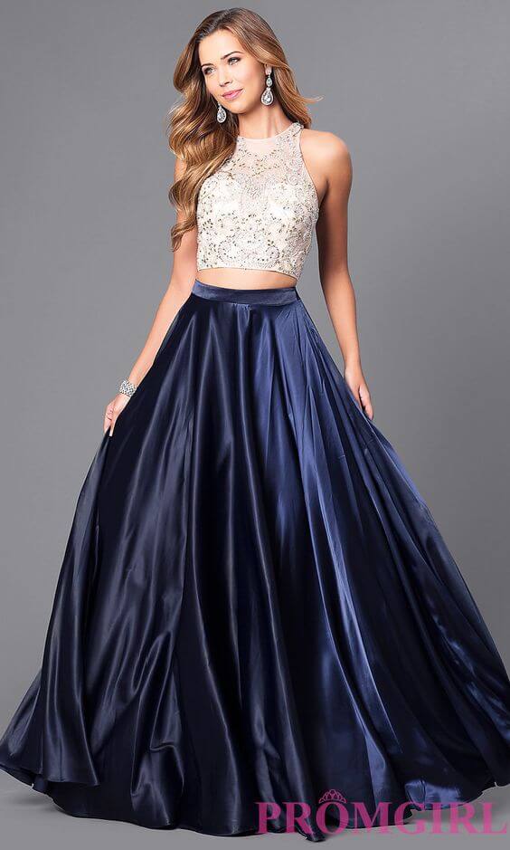 Girl in two piece prom dress with cream colored top and navy blue full skirt